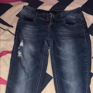 Distressed blue jeans